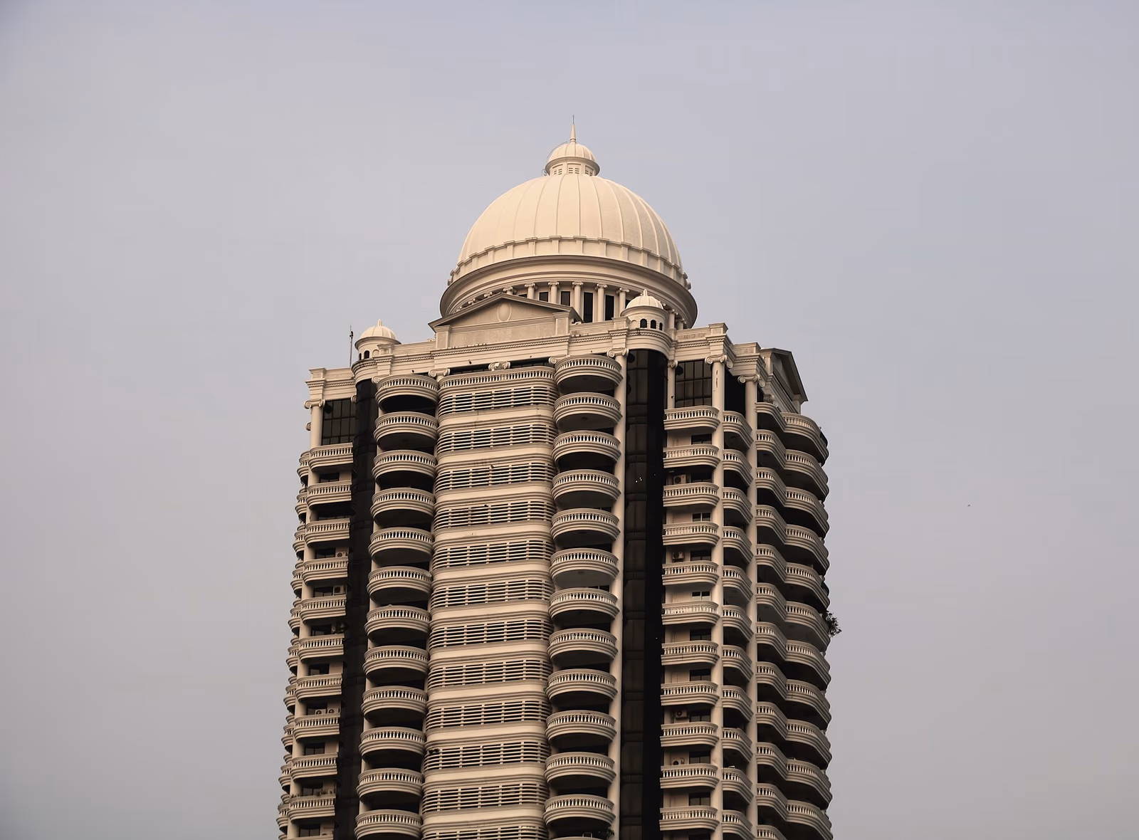 Origin Property Park Origin Phayathai high-rise condominium tower in Bangkok with BTS Phayathai station visible, representing Origin's BTS-corridor and EEC condominium focus