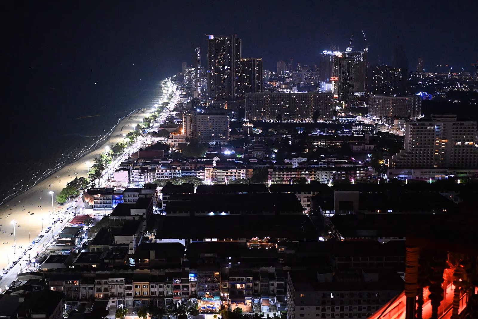 Pattaya Bay coastline with high-rise condominium towers lining the beachfront